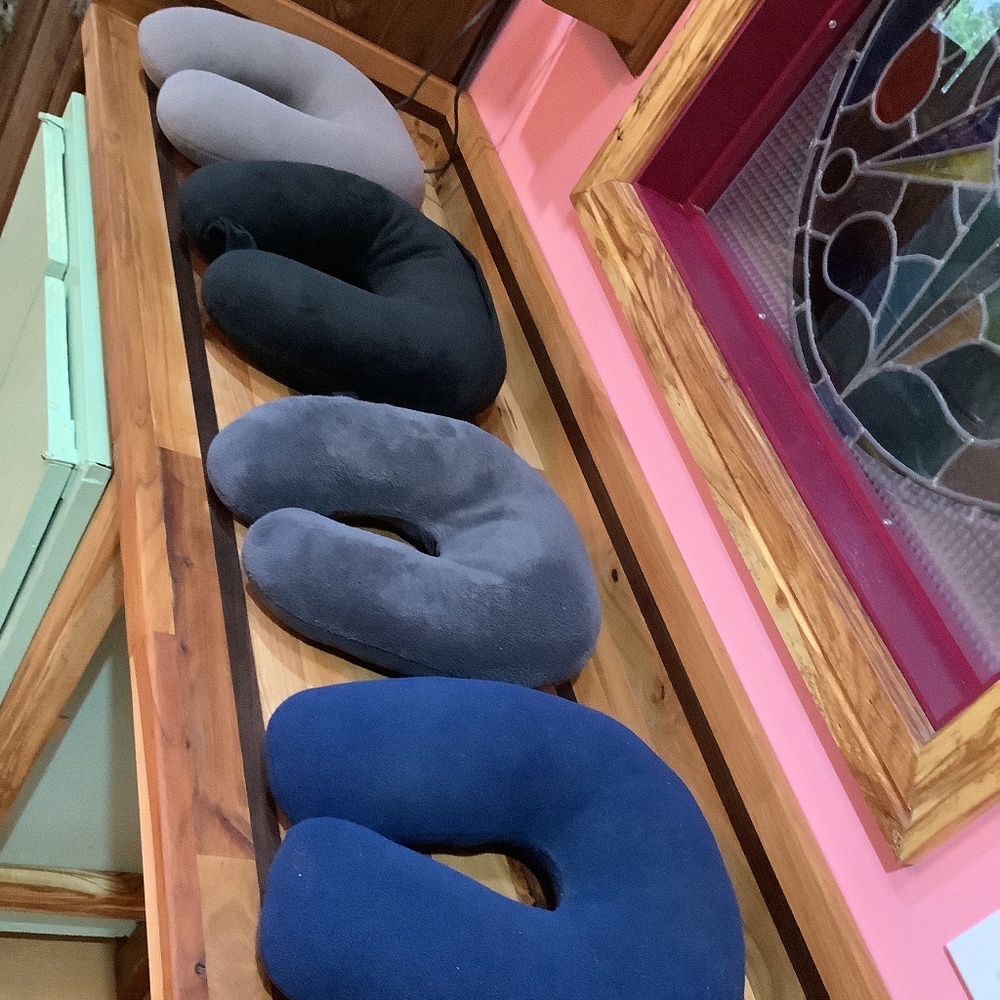 4 Colours of Travel Neck Pillows (grey, beige, black, blue) two with zippers.